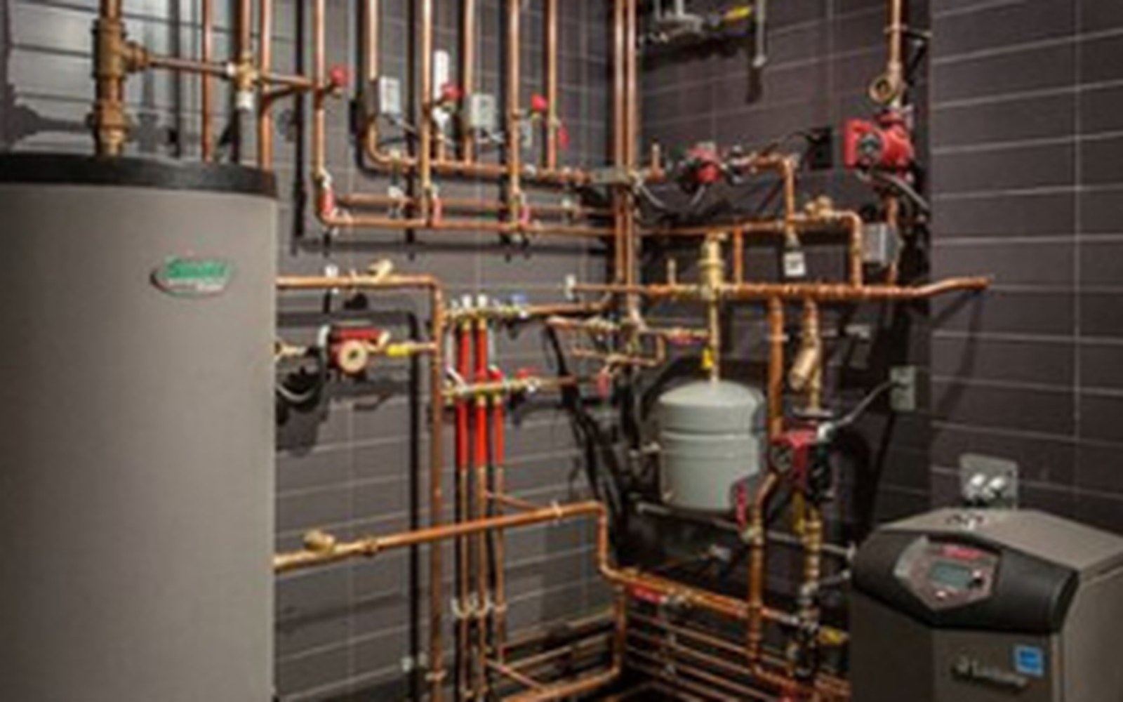 Copper heating manifold installed by Fortitude Plumbing in Edmonton